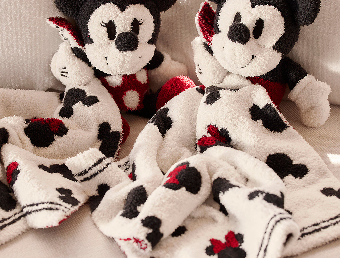 Barefoot Dreams Disney Blanket Buddies in Mickey Mouse and Minnie Mouse side by side