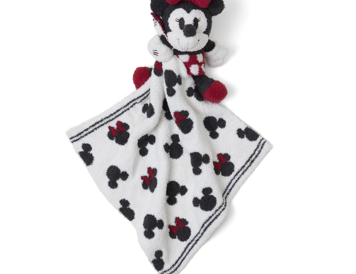 Barefoot Dreams Disney Blanket Buddie in Minnie Mouse, a knit Minnie plush on a Mickey-print lovey blanket
