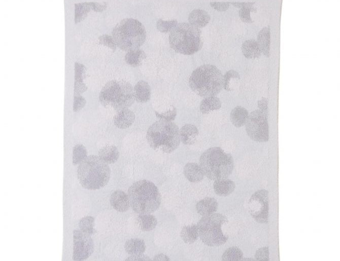 Barefoot Dreams Disney Stroller Blanket in Mickey Stamped, a pale gray blanket with tonal Mickey silhouettes