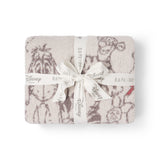 Barefoot Dreams Disney Stroller Blanket in Winnie the Pooh folded and tied with a Disney ribbon