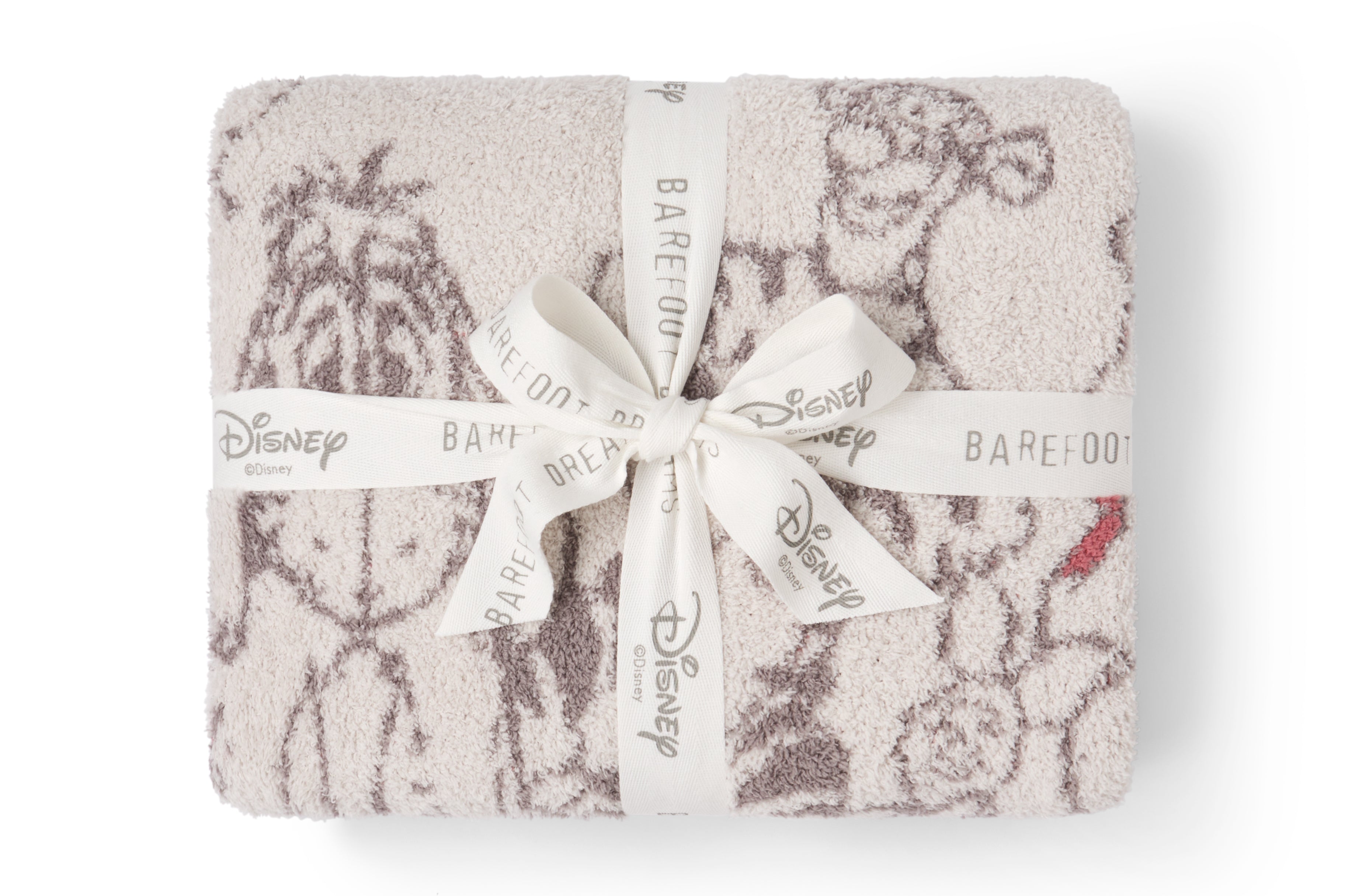 Barefoot Dreams Disney Stroller Blanket in Winnie the Pooh folded and tied with a Disney ribbon