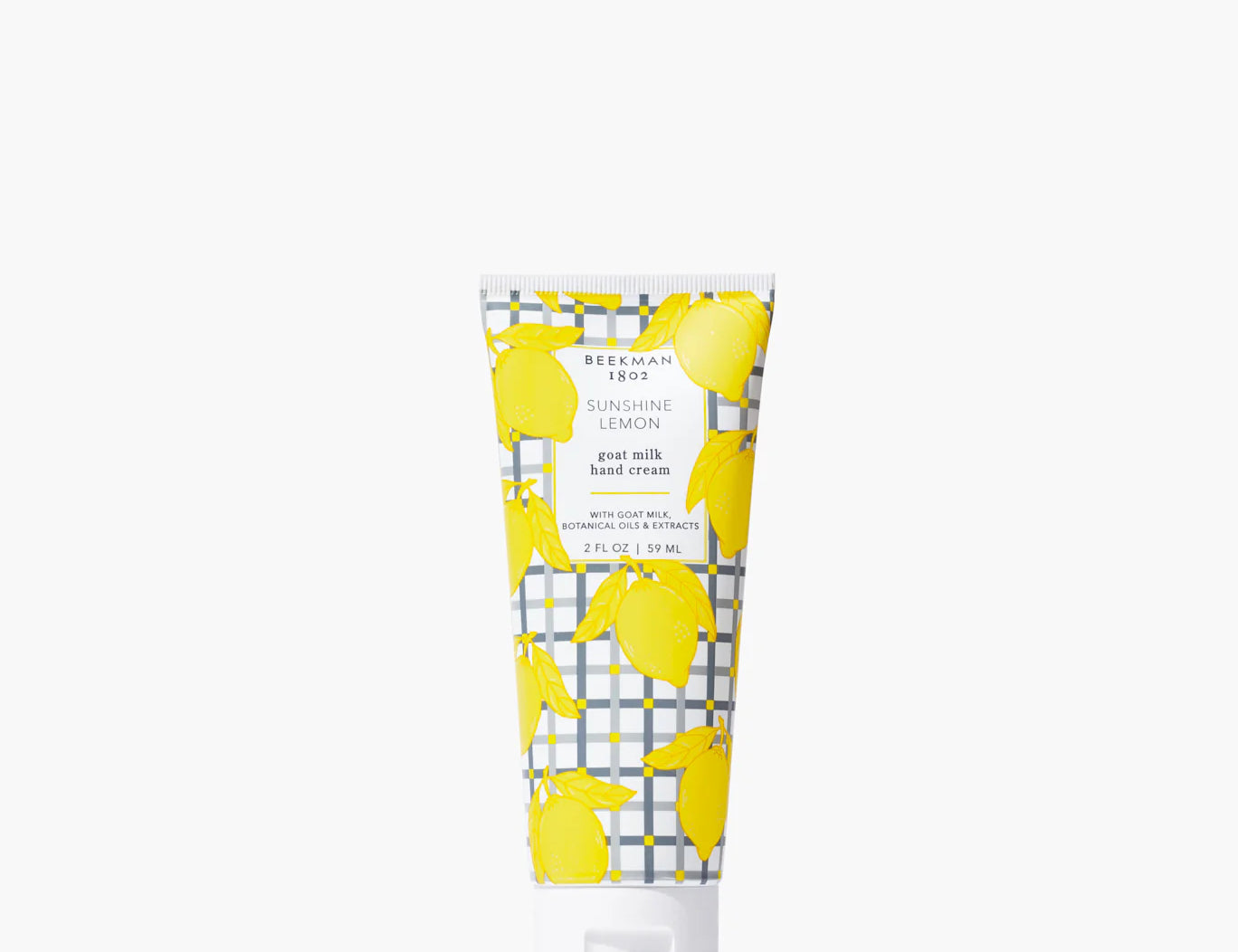 Beekman 1802 2oz Hand Cream in Sunshine Lemon, a goat milk hand cream tube with a yellow lemon print