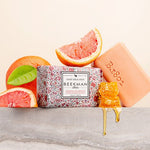 Beekman 1802 Bar Soap in Honeyed Grapefruit with the peach soap bar, grapefruit slices and honeycomb