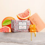 Beekman 1802 Bar Soap in Honeyed Grapefruit with the peach soap bar, grapefruit slices and honeycomb