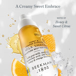 Beekman 1802 Milk Shake Moisture Mist in Honey & Orange Blossom with orange slices and honeycomb