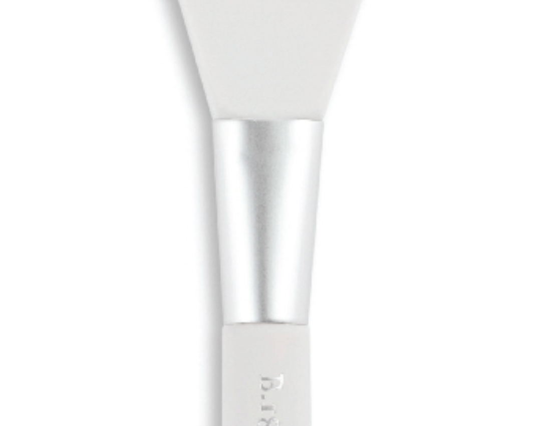 Beekman 1802 Whipped Body Cream Spatula, a white silicone spatula with a clear handle