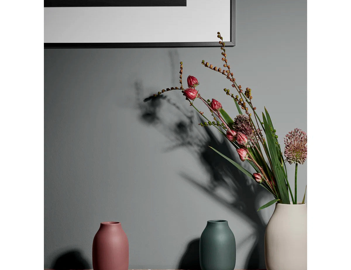 Blomus COLORA Porcelain Vases in burgundy, green and cream on a marble shelf with dried flowers