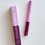 Botanica Flameless Lighter in Berry, a lavender and plum USB lighter beside its box
