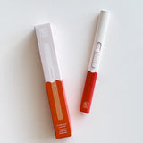 Botanica Flameless Lighter in Poppy, a white and red USB lighter beside its box