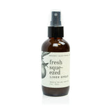 Broken Top Brands Fresh Squeezed Linen Spray in an amber glass bottle with a black spray top