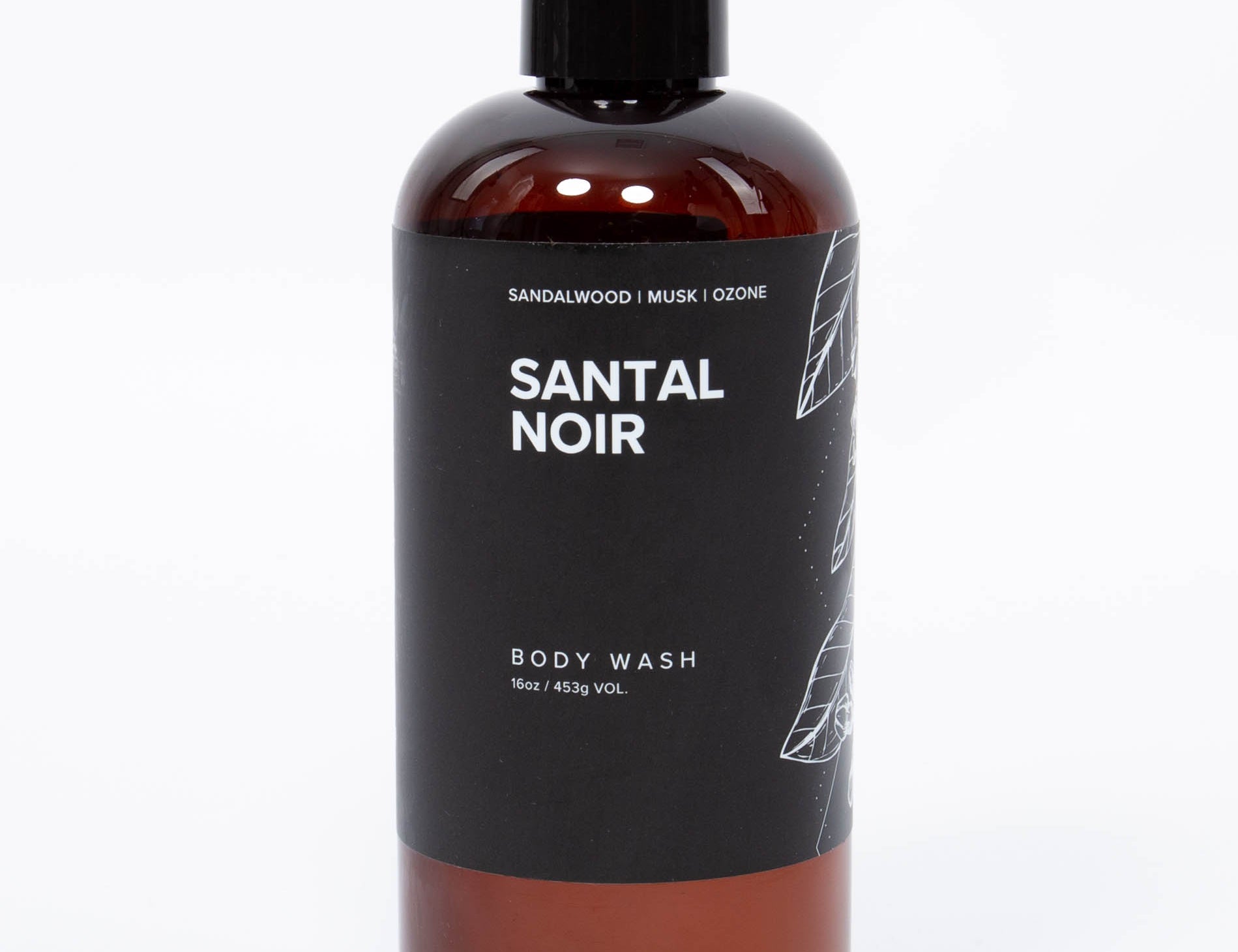 Broken Top Brands Santal Noir Body Wash in an amber bottle with a black pump
