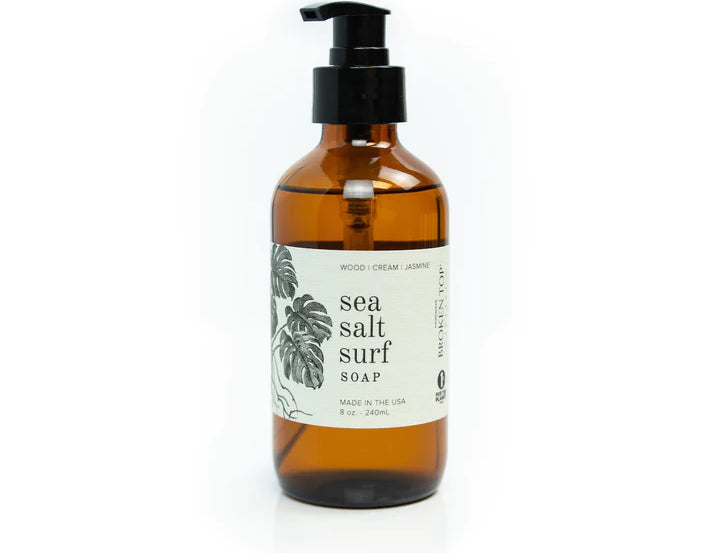 Broken Top Brands Sea Salt Surf Hand Soap in an amber glass pump bottle with a monstera label