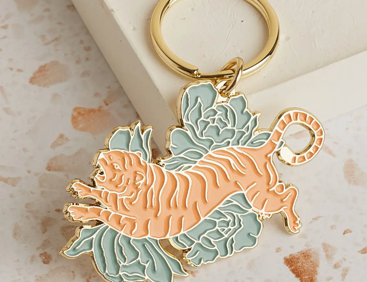 Cai & Jo Floral Tigress Enamel Keychain, a gold-outlined tiger with green florals on a gold ring