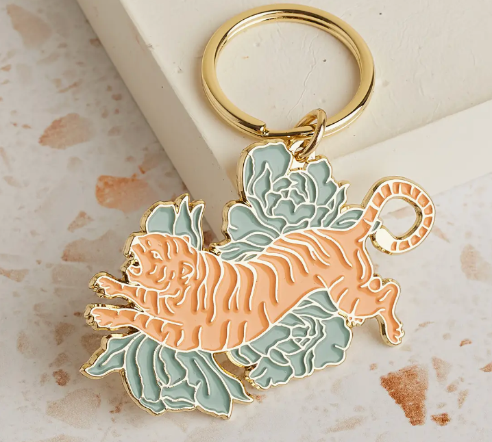 Cai & Jo Floral Tigress Enamel Keychain, a gold-outlined tiger with green florals on a gold ring