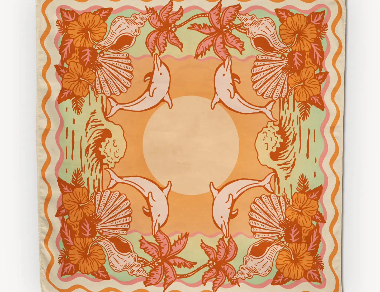 Cai & Jo Tavarua Bandana, an orange and sage bandana with dolphins, hibiscus and shells around a sun
