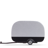 Candylab Toys Airstream Camper, silver wooden toy trailer with black base and a tow hitch, side view