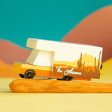 Candylab Toys Arizona Wooden RV toy camper on an orange desert-styled backdrop with teal sky
