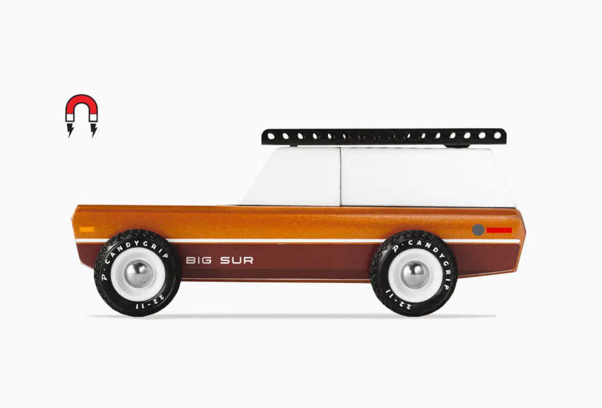Candylab Toys Big Sur wooden toy car in brown and white with a black roof rack, side view