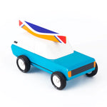 Candylab Toys Cotswold Wooden Royal Toy, a blue wooden car with a roof surfboard, angled view