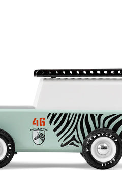 Candylab Toys Drifter Zebra Toy Truck, a mint green wooden SUV with zebra stripes and a black roof rack, side view