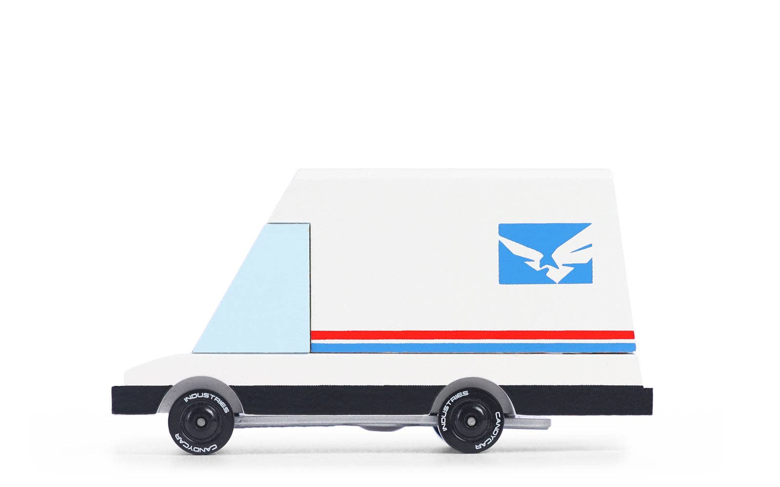Candylab Toys Futuristic Mail Van, a white wooden toy van with red and blue stripes and an eagle logo, side view