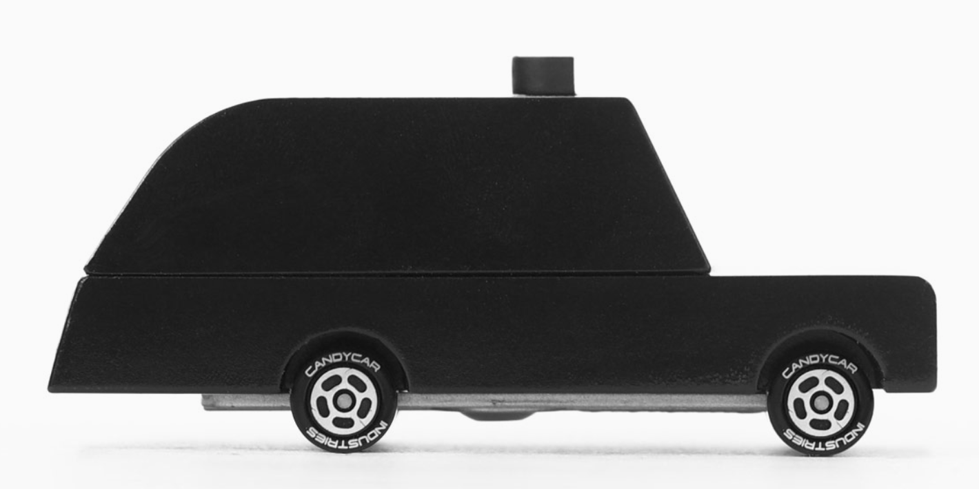 Candylab Toys London Taxi, a black wooden toy cab, close-up side view