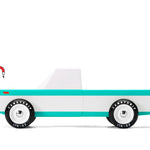 Candylab Toys Longhorn Toy Truck, a teal and white wooden pickup truck, side view