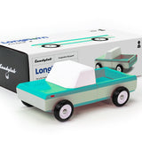 Candylab Toys Longhorn Toy Truck beside its white and teal retail box