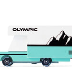 Candylab Toys Olympic Wooden RV, a teal and white camper van with a mountain graphic, side view