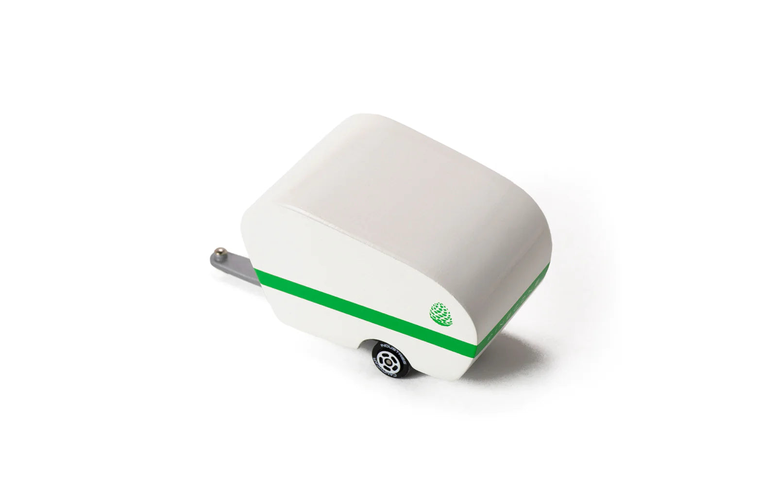 Candylab Toys Pinecone Toy Camper, white wooden trailer with a green stripe, angled view