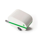 Candylab Toys Pinecone Toy Camper, white wooden trailer with a green stripe, angled view