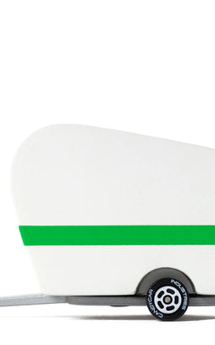 Candylab Toys Pinecone Toy Camper, a white wooden teardrop trailer with a green stripe and pinecone logo, side view