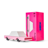Candylab Toys Pink Wooden Sedan beside its hot pink retail box