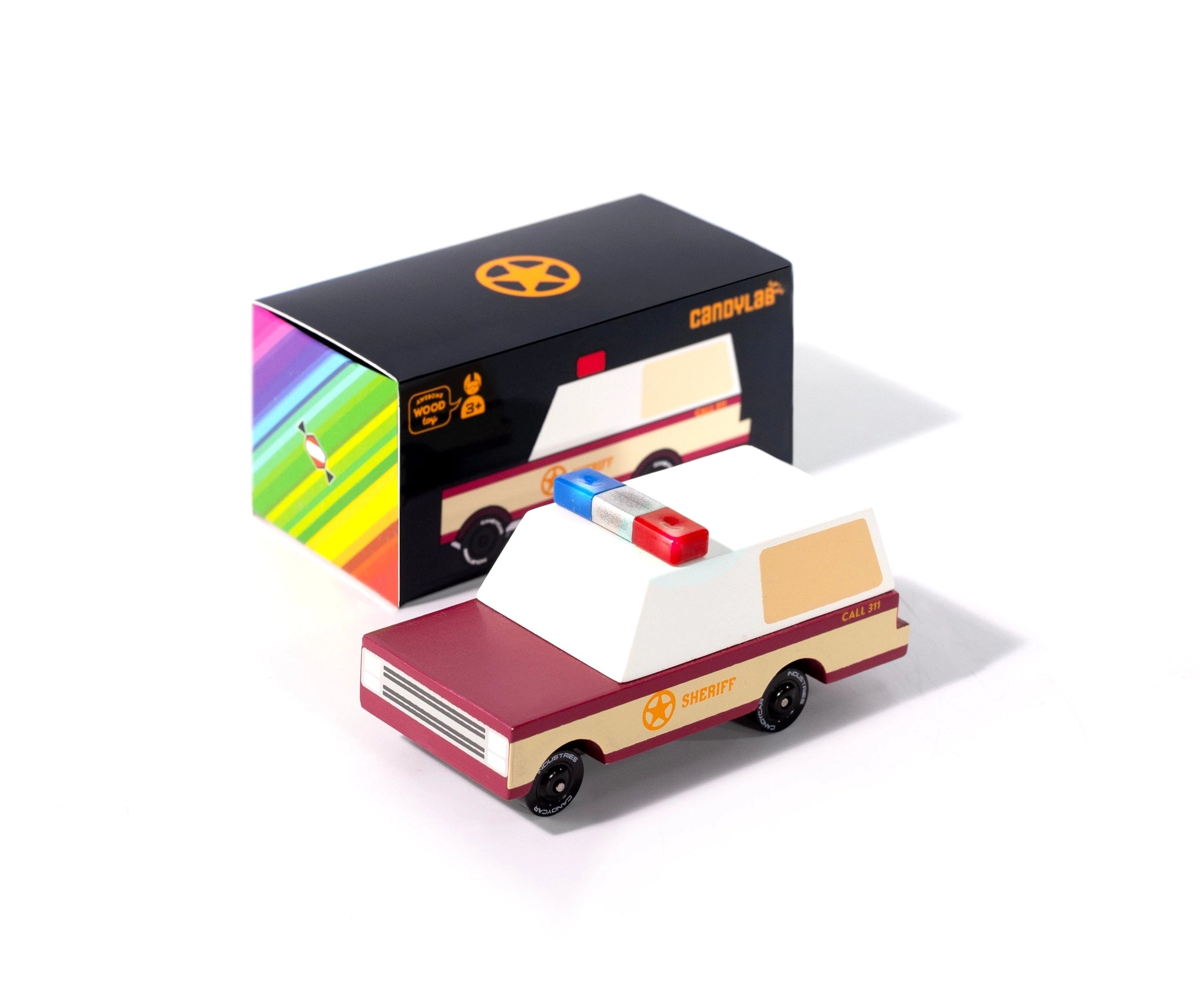 Candylab Toys Sheriff Truck beside its black and rainbow retail box