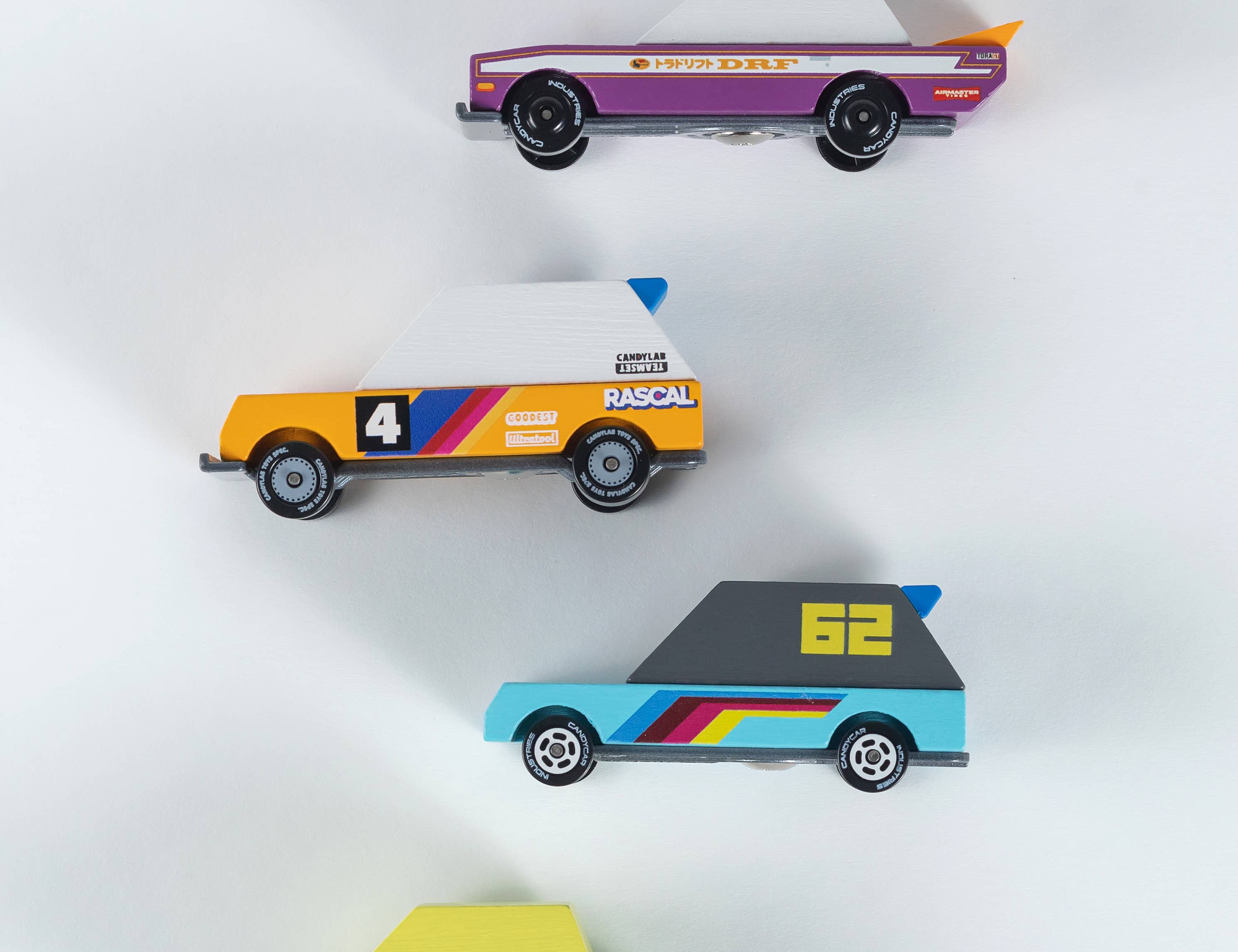 Candylab Toys Tokyo Heat TOONS 4-Pack, four wooden cars: purple, orange, blue and green racers, from above