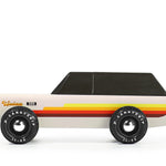 Candylab Toys Wanderer Toy Truck, a cream and black wooden SUV with red and yellow stripes, side view
