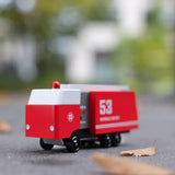 Candylab Toys Wooden Fire Truck 53 on pavement outdoors