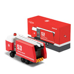 Candylab Toys Wooden Fire Truck 53 beside its red retail box