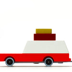 Candylab Toys Wooden Luggage Wagon, a red and white wooden station wagon with stacked luggage on the roof, side view