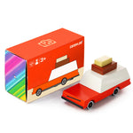 Candylab Toys Wooden Luggage Wagon beside its red retail box