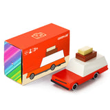 Candylab Toys Wooden Luggage Wagon beside its red retail box