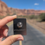 Back of the Canyonlands Island in the Sky enamel pin showing the rubber clutch.