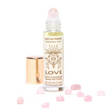 Cast of Stones Roll On Aromatherapy Love Oil with a rose quartz rollerball and loose rose quartz stones
