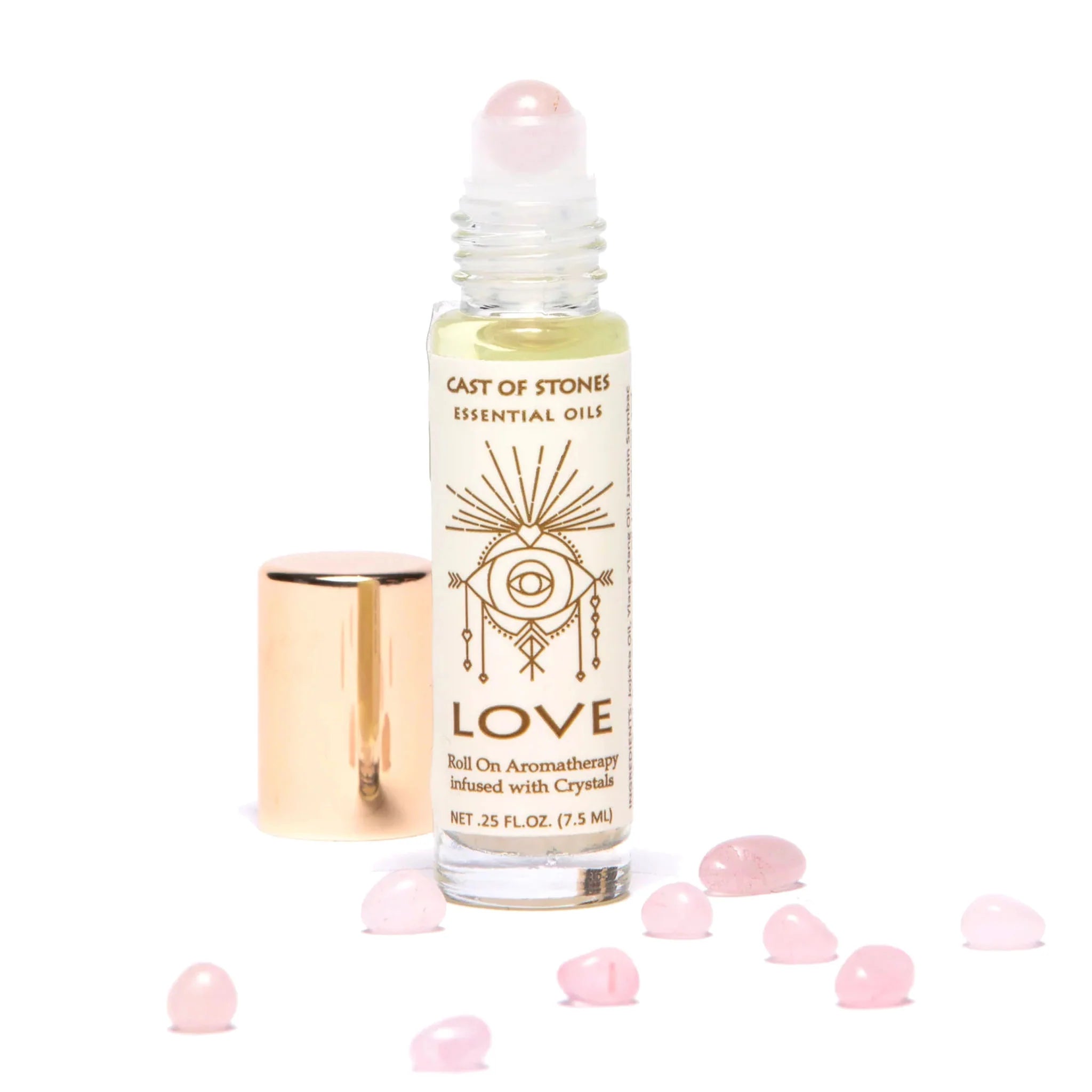 Cast of Stones Roll On Aromatherapy Love Oil with a rose quartz rollerball and loose rose quartz stones