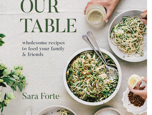 Around Our Table cookbook by Sara Forte, Chronicle Books, cover showing hands serving bowls of green salads and grains