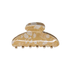 Classic claw clip in Canyon Rose, a glossy hair claw clip printed with white roses and daisies on a warm clay rose ground, on a white background.