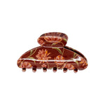 Classic claw clip in Ember Floral, a glossy cream hair claw clip with a warm orange and pink floral print, on a white background.