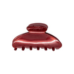 Classic claw clip in Garnet, a glossy deep red hair claw clip, on a white background.