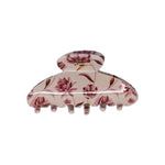 Classic claw clip in Mulberry Floral, a glossy light beige hair claw clip with a dusty pink and burgundy floral print, on a white background.