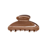 Classic claw clip in Roman Clay, a glossy warm brown hair claw clip with a small embossed logo on the top loop, on a white background.